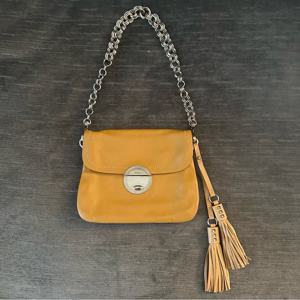 Prada leather shoulder bag with chain and tassels